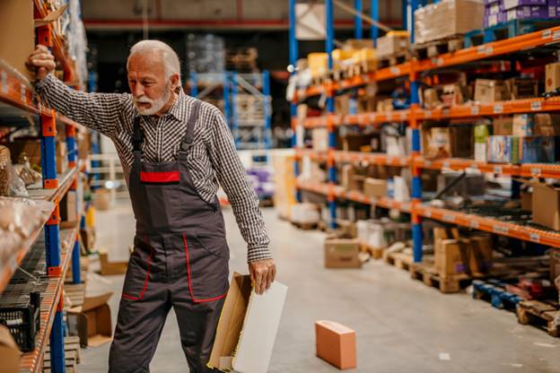 Older man taking a break at warehouse job - Age Discrimination